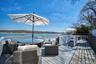 The property features an expansive deck with water views.