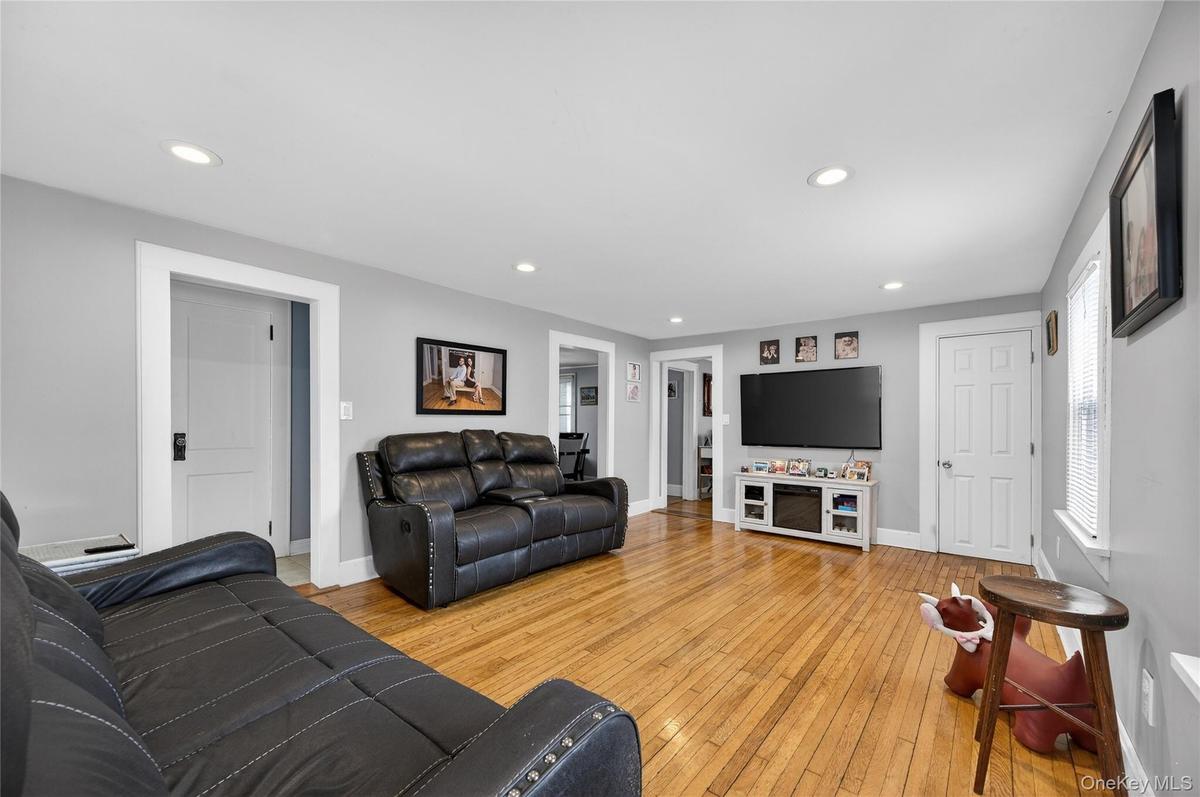 Living Room/ Family Room. Beautiful hardwood floors, recessed lighting and closet.