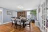 Formal Dining Room with hardwood floors, multiple windows and access to porch.