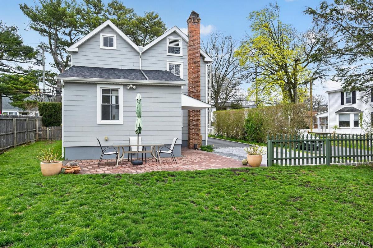 Backyard with a brick terrace.