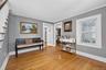 Spacious open entry with hardwoods and hall coat closet.