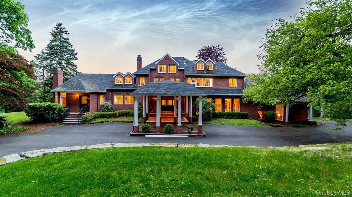 Western elevation of home with mountain and forest views