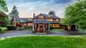 Western elevation of home with mountain and forest views