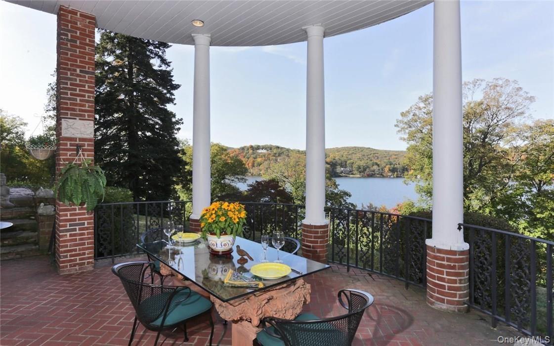 Expansive covered lakeside terrace perfect for al fresco dining