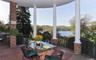 Expansive covered lakeside terrace perfect for al fresco dining