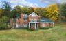 West elevation of house with autumn foliage