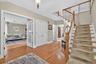 Entrance foyer with stairway and wood finished floors