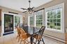 Dining area with baseboard heating, light tile patterned floors, and ceiling fan