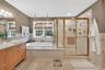 Full bath with vanity, a bath, tile patterned floors, and a stall shower