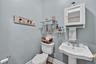 Half bathroom with toilet and a sink