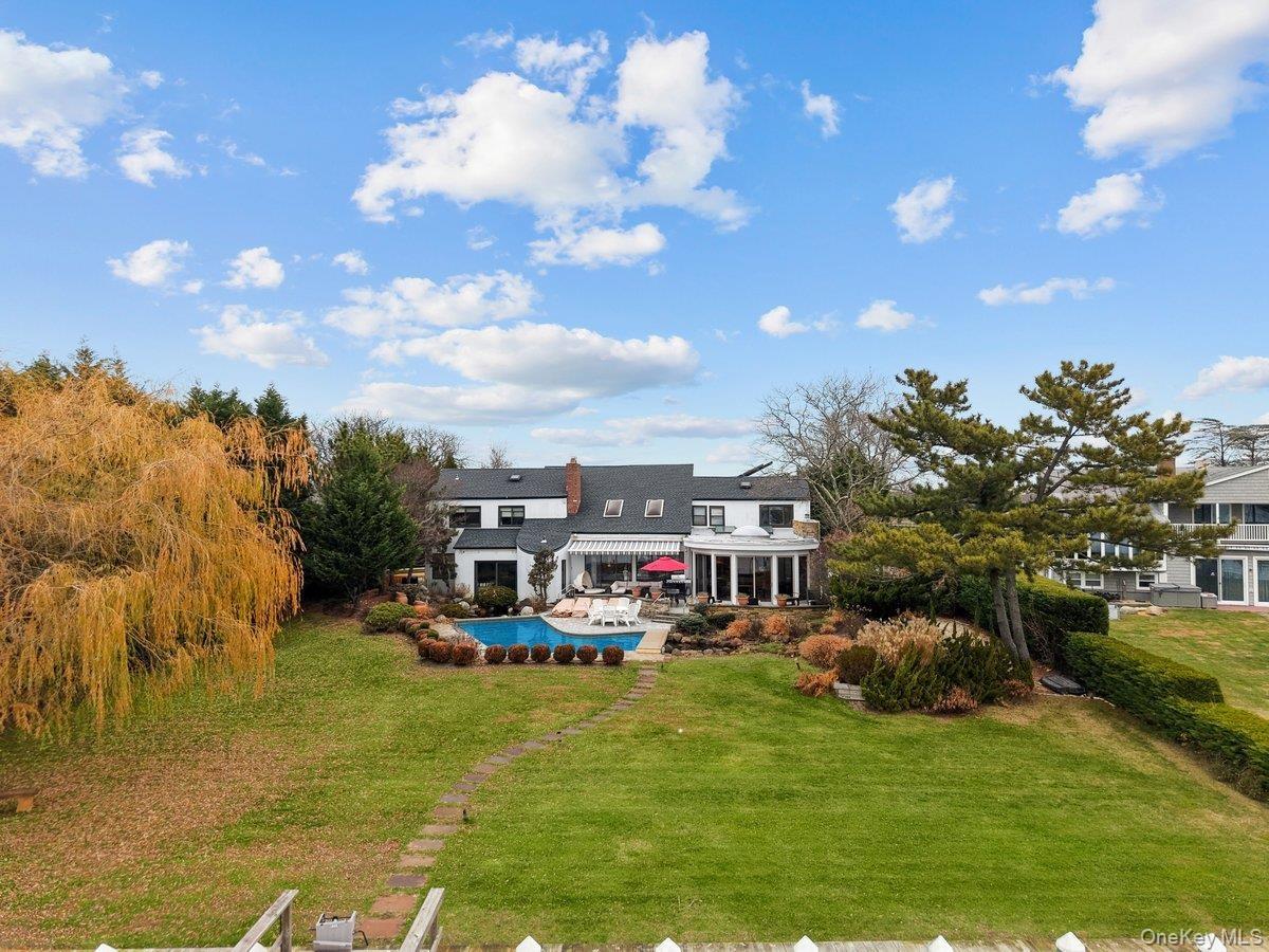 BACK OF THE HOUSE WITH HEATED POOL