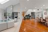 FORMAL DINING OPEN TO FORMAL LIVING ROOM WITH CATHEDRAL CEILINGS