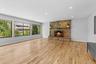 Unfurnished living room featuring baseboards, a fireplace, light wood-style floors, and recessed lighting