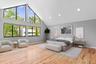 Bedroom featuring baseboards, light wood-type flooring, high vaulted ceiling, and recessed lighting (virtually staged)
