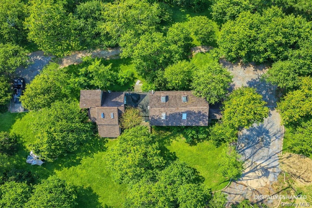 Aerial view of cottage property and surrounding area - Digitally Enhanced