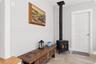 Cozy Sitting Room with Free-Standing Wood Burning Stove