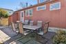 Back of House with Picnic Table and Chairs