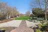 View Outside of Back of House. View of Pavers, Backyard, Beach and Canal