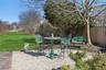 Wrought Iron Table and Chairs in Backyard.