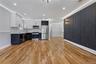 Kitchen with two tone cabinets, light countertops, stainless steel appliances, light wood-style flooring, and recessed lighting