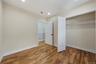 Unfurnished bedroom with light wood-style floors, recessed lighting, and a closet