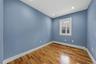 Spare room featuring baseboard heating, light wood-type flooring, and recessed lighting