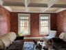 Currently used as a sitting room with healthy amount of natural light, beam ceiling, coffered ceiling, wood finished floors, and crown molding