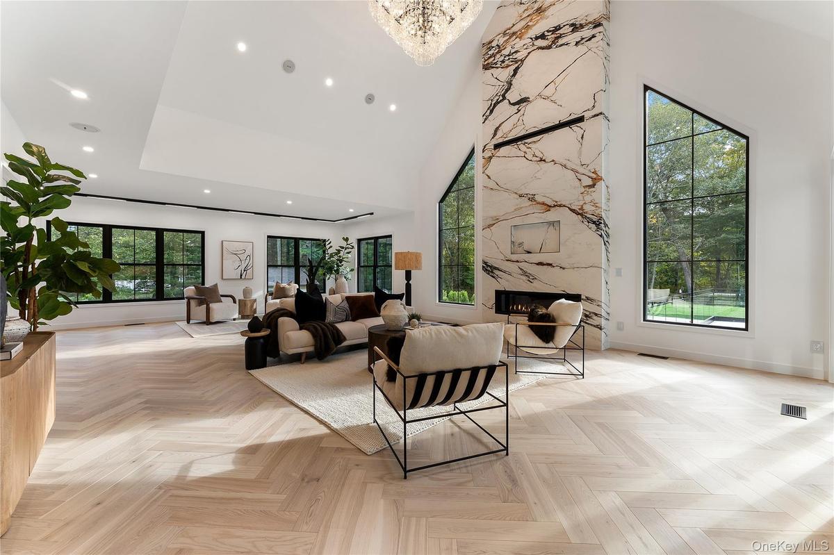 Living Room with a towering ceiling and recessed lighting