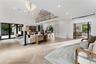 Living Room featuring recessed lighting and a high ceiling