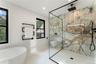 Full bath with a marble finish shower, a freestanding tub, recessed lighting, and tile patterned floors