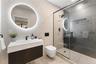 Full bathroom with tile walls, vanity, a stall shower, and tile patterned flooring