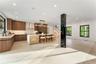 Kitchen with modern cabinets, plenty of natural light, a kitchen island, pendant lighting, and recessed lighting