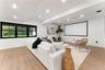 Home theater with recessed lighting and light wood-style floors