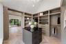 Spacious closet featuring high vaulted ceiling