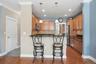 Here you'll find a peninsula with a granite overhang to pull up to ----and enjoy your morning coffee!