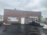 View of front of property featuring brick siding