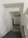 Stairway featuring wood finished floors and baseboards