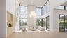 The great room blends refined interiors with the surrounding landscape; anchored by a sleek linear fireplace and complemented by a built-in bar with w