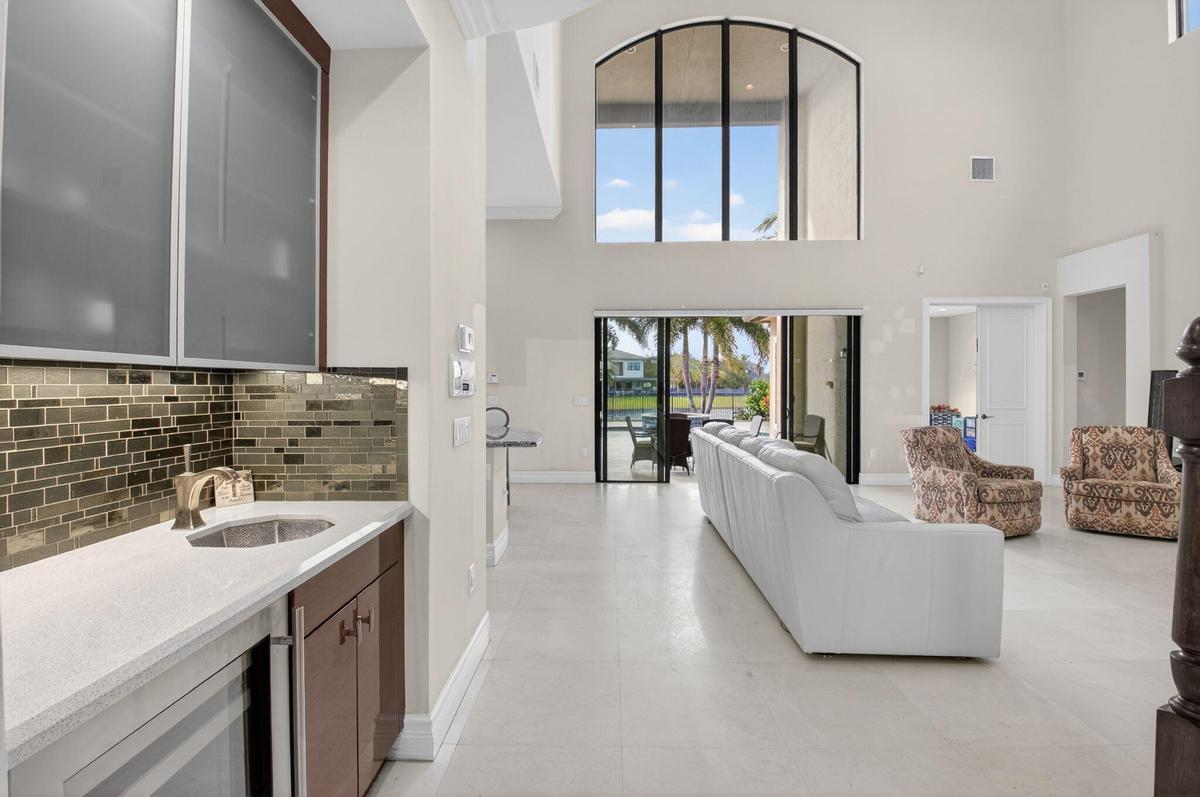 MARBLE FLOORS THRUOUT DOWNSTAIRS LOOK STRAIGHT OUT INTO THE POOL AND LAKE