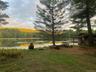 water view and a wooded view small boathouse