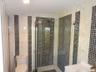 Single sink vanity with stall shower glass enty