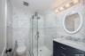 Full bath, first floor off SItting room - single sink vanity with stall shower, glass entry