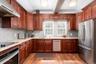 Gourmet Kitchen with wood cabitnetry, granite tops, stainless appliances