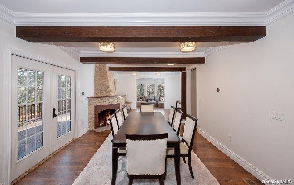 Formal Diing Room with French doors to deck with another fireplace