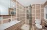 Bath, single sink vanity, stall shower glass door entry