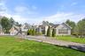 View of front of property featuring a driveway and a front lawn