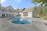 View of swimming pool featuring patio surround and french doors