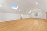 2nd floor recreation room with a skylight, light wood-type flooring, and recessed lighting