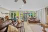 Spacious room with large windows and glass doors providing abundant natural light