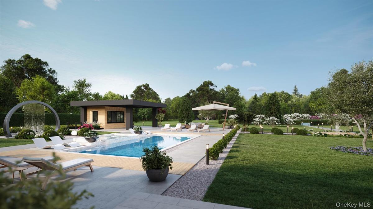 A resort-caliber poolscape featuring a waterfall feature, integrated spa, and sunken lounge sets the stage for elevated outdoor living. The adjacent p
